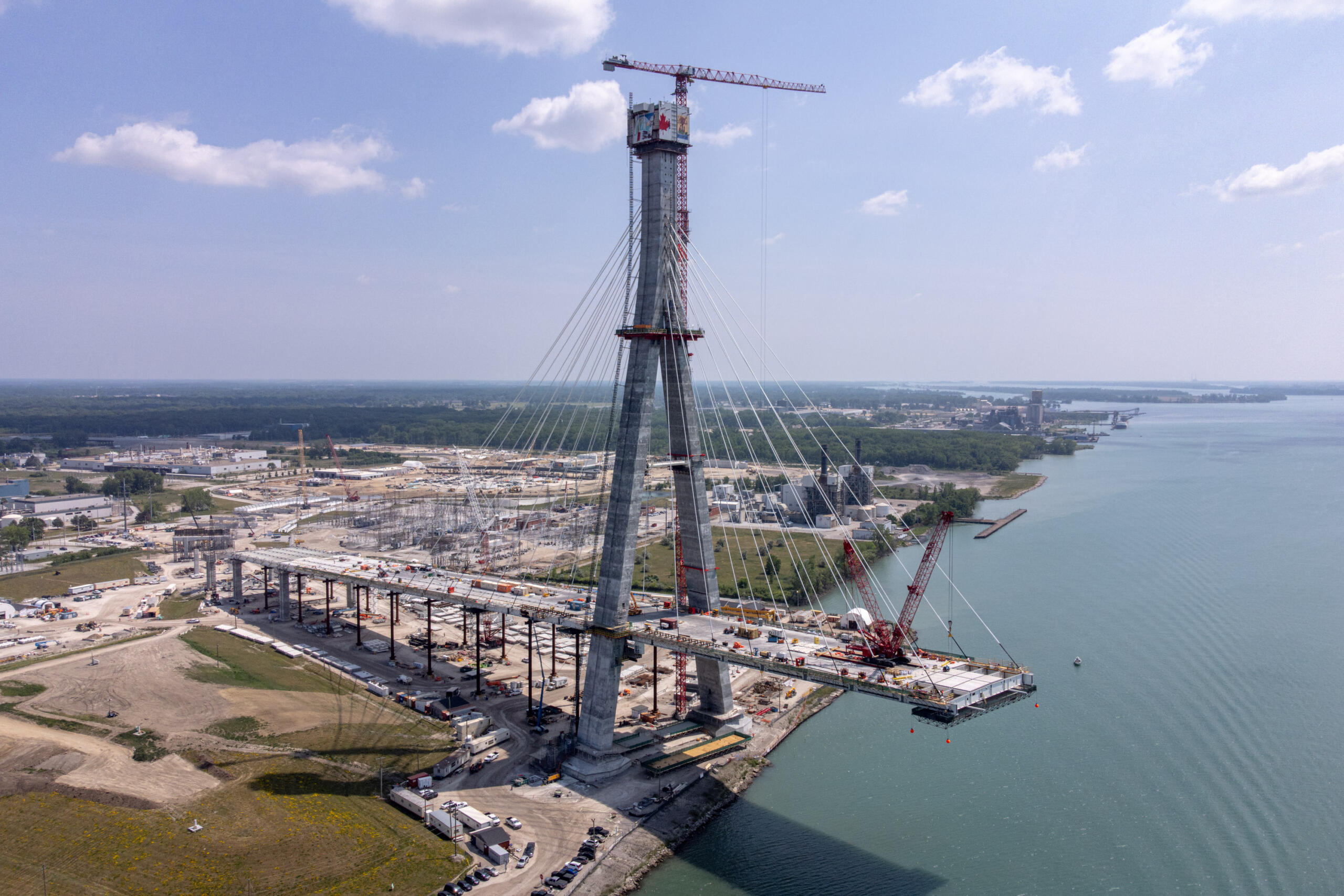 Rendering of New Gordie Howe International bridge spaning across Detroit River from Windsor Ontario to Detroit Michigan
