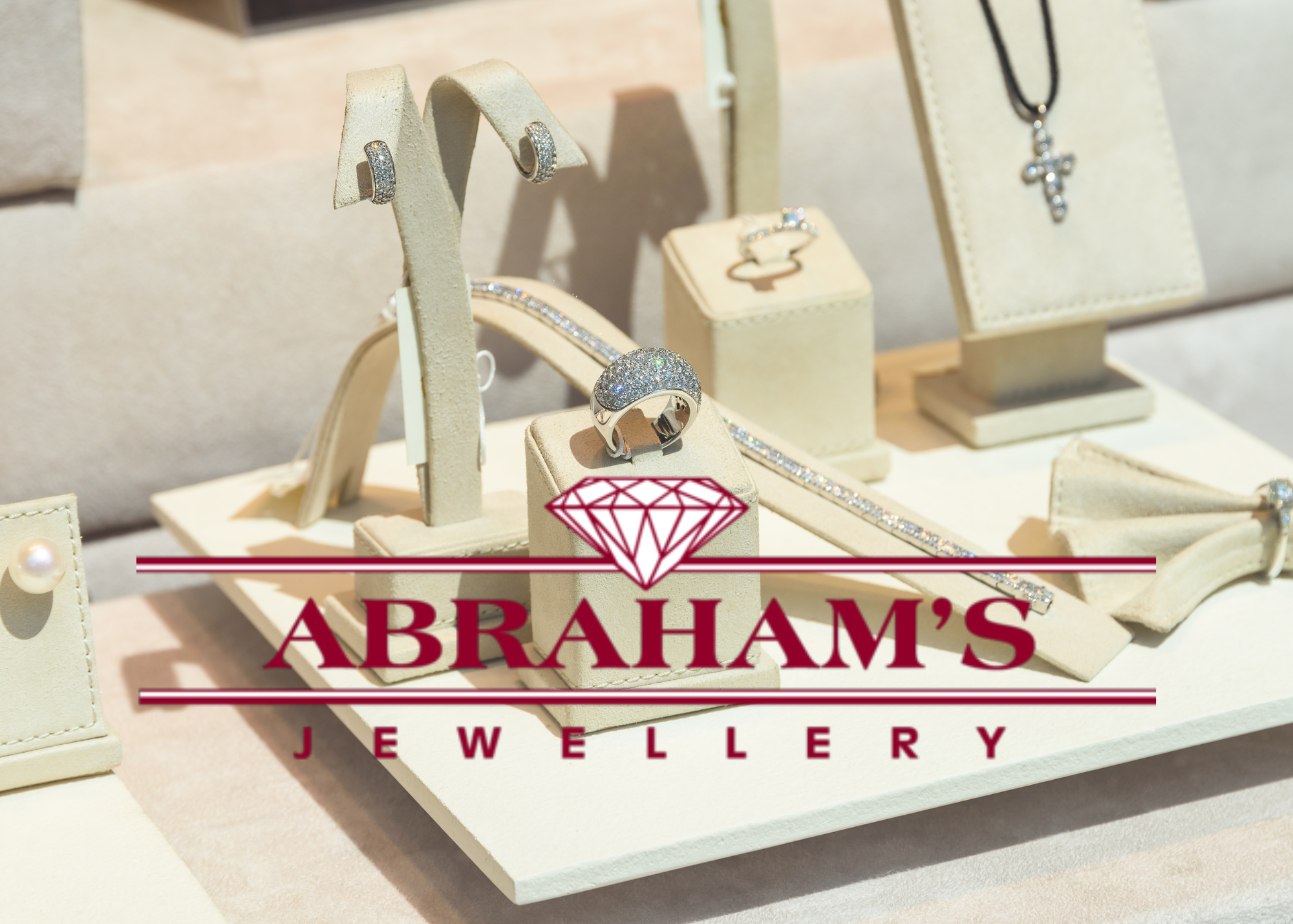 abraham's jewellery logo deep red and white